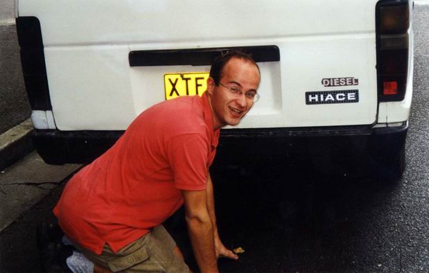Mario kneeing behind his (actually at that time still mine) Toyota...